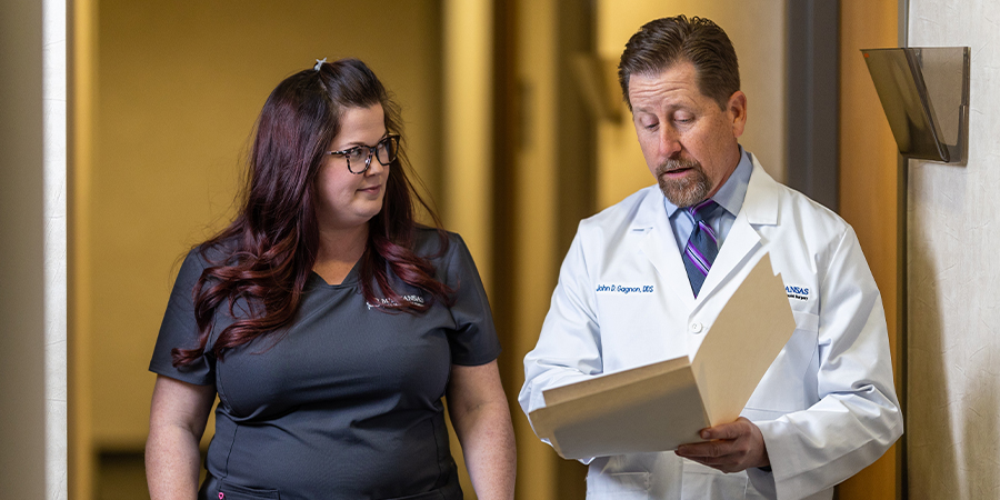 doctor discussing a procedure with an assistant