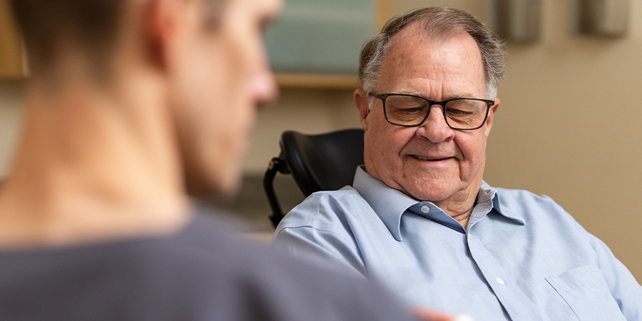 patient getting instruction from a surgeon